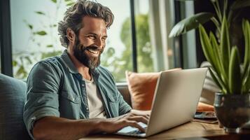 A happy man paying bills online with laptop in living room. Online shopping. Generative Ai photo