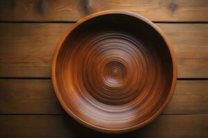 Empty wooden bowl on wooden background. Top view. Copy space. ai generative photo