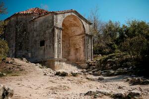 Mausoleum of Dzanike-Khanym in cave city Chufut-Kale, Bakhchisaray, Crimea. It's built in XV century in Near East style. photo