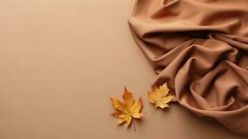 Autumn background. Autumn leaves and satin fabric on a beige background. Generative AI photo