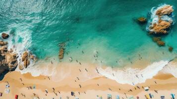 Aerial shot of a crowded beach with swimmers enjoying the waves photo