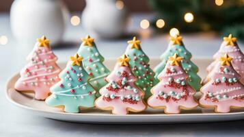 Colorful sugar cookies shaped like Christmas trees and reindeer photo