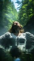 Peaceful image of a woman floating on her back in a tranquil lake photo