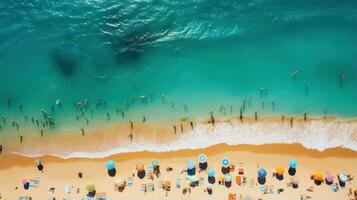 Aerial shot of a crowded beach with swimmers enjoying the waves photo