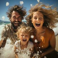 Smiling family playing in the ocean waves on a sunny day photo