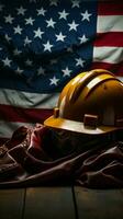 American flag waves by helmet and tools, embodying Labor Days essence Vertical Mobile Wallpaper AI Generated photo
