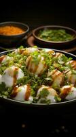 South Asian gem Dahi vada bhalla, a flavorful chaat, hailing from Indias culinary heritage Vertical Mobile Wallpaper AI Generated photo