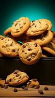 Chocolate chip cookies tumble from a paper box against a turquoise backdrop Vertical Mobile Wallpaper AI Generated photo