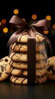 Gourmet cookies, presented in a front view with a stylish dark ribbon bow Vertical Mobile Wallpaper AI Generated photo