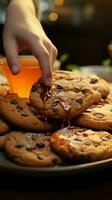 In detail Hand snags chocolate cookies, juggles them with an orange juice Vertical Mobile Wallpaper AI Generated photo