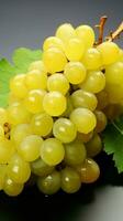 An abundance of Shine Muscat grapes, both whole and sliced, on a white surface Vertical Mobile Wallpaper AI Generated photo