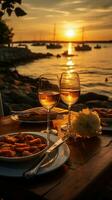 A honeymoon sunset dinner by the beach, with a table set for two, luxurious cuisine, champagne, and a picturesque sea view with yachts in the background Vertical Mobile Wallpaper AI Generated photo