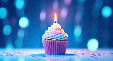 Birthday cupcake with burning candle on blue bokeh background. AI Generated. photo