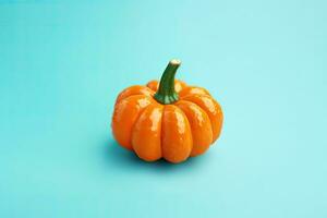 Pumpkin on blue background with copy space. Minimal style. AI Generated. photo