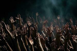 Group of people hands raised up in the air on a black background. AI Generated. photo