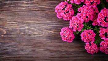 Pink flowers on wooden background. Top view with copy space. Toned. AI Generated. photo