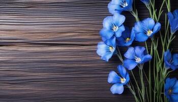 Blue flowers of flax on a wooden background. View from above. AI Generated. photo