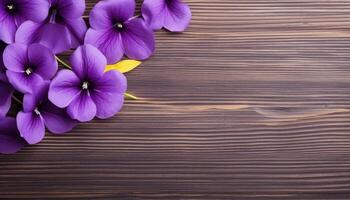 Purple pansy flowers on wooden background. Top view with copy space. AI Generated. photo