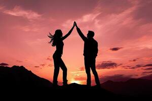 Silhouette of man and woman giving high five on sunset background. AI Generated. photo