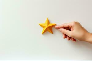 Female hand holding a paper star on a white background. Top view. AI Generated. photo