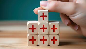 Close-up Of Businessman's Hand Building Red Cross On Wooden Blocks. AI Generated. photo