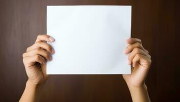 Hands holding a blank paper sheet with copy space on brown background. AI Generated. photo