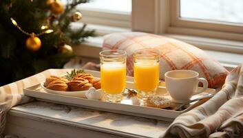 dos lentes de naranja jugo y galletas en un bandeja cerca el Navidad árbol. ai generado. foto