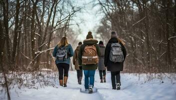 Group of friends walking in the winter forest with backpacks. Back view. AI Generated. photo