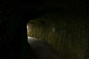 Narrow passage in dim light photo