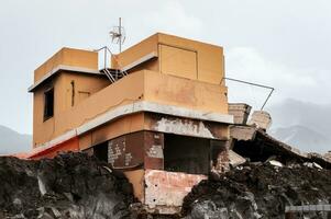 Building destroyed by the volcanic lava flow from the Cumbre Vieja volcano, on the island of La Palma photo
