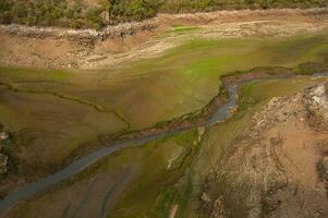 The Ponsul River is a affluent of the Tejo River, in Portugal, and is a very large river. At this time it is completely dry, without water and with its bed cracked due to climate change photo