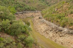 The Ponsul River is a affluent of the Tejo River, in Portugal, and is a very large river. At this time it is completely dry, without water and with its bed cracked due to climate change photo