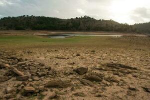 The Ponsul River is a affluent of the Tejo River, in Portugal, and is a very large river. At this time it is completely dry, without water and with its bed cracked due to climate change photo