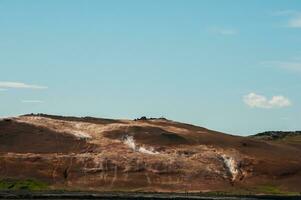 Smoldering sulfur fumaroles at Hverir in the Krafla volcanic system of Iceland photo