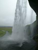 The imposing waterfall of Seljalandsfoss, Iceland photo