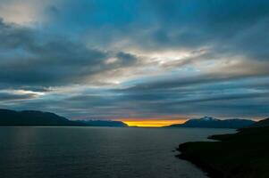 Sunset at midnight in Iceland photo