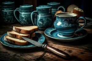 Table with blue porcelain cups and teapot and slices of bread and cake for breakfast. AI generated photo