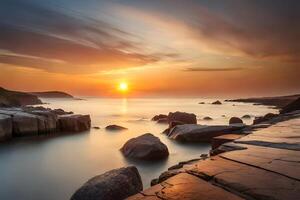 A tough rough coast washed in warm colors amid a dazzling dusk. photo