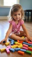 A young child using blocks to learn basic counting and math skills. photo