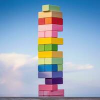 Colorful blocks stacked high in a tower photo