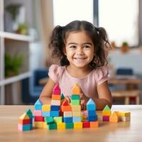 A young child using blocks to learn basic counting and math skills. photo