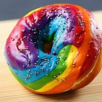 arco iris rosquilla. rosquilla teñido con brillante colores, a menudo con crema queso foto