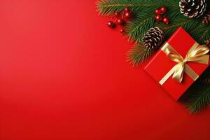 Christmas background with fir branches, cones and gift box on red background Ai generated photo