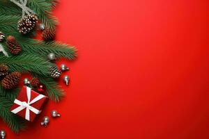 Christmas background with fir branches, cones and gift box on red background Ai generated photo