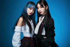 Portrait of two beautiful asian women in Fashion outfits on blue background AI Generated photo