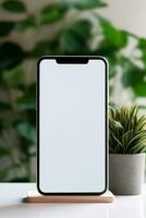 Mockup smartphone with blank screen on table with green plant AI generated photo