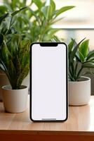 Mockup smartphone with blank screen on table with green plant AI generated photo