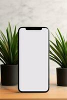 Mockup smartphone with blank screen on table with green plant AI generated photo