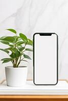 Mockup smartphone with blank screen on table with green plant AI generated photo