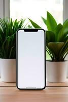 Mockup smartphone with blank screen on table with green plant AI generated photo